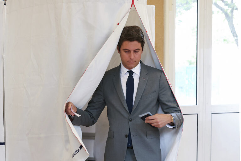 French Prime Minister Gabriel Attal, leaves the polling booth before voting for the second round of the legislative election, Sunday, July 7, 2024 in Vanves, outside Paris. Voting has begun in mainland France on Sunday in pivotal runoff elections that could hand a historic victory to Marine Le Pen's far-right National Rally and its inward-looking, anti-immigrant vision — or produce a hung parliament and years of political deadlock. (Alain Jocard, Pool via AP)