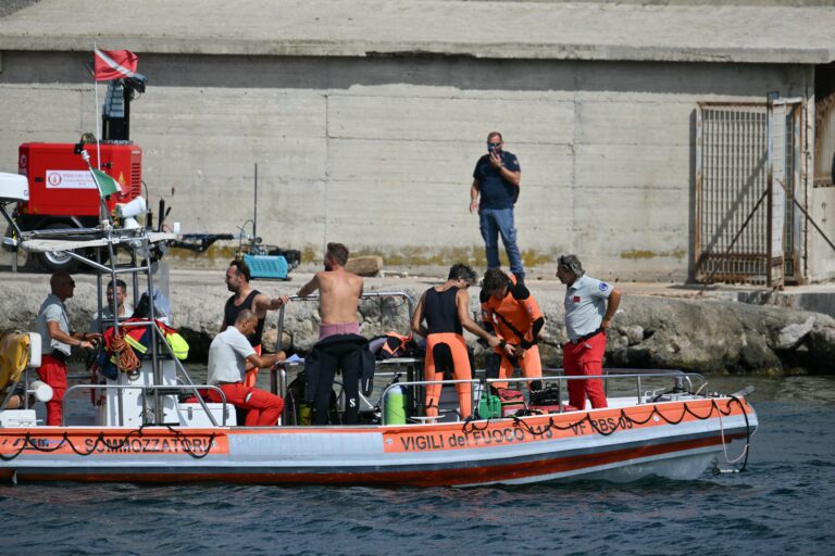 Divers of the Vigili del Fuoco, the Italian Corps. of Firefighters, leave Porticello for the rescue site, on August 20, 2024 near Palermo a day after the British-flagged luxury yacht Bayesian sank. Specialist divers launched a fresh search for six people, including UK tech tycoon Mike Lynch and the chairman of Morgan Stanley International, missing since their yacht capsized off the Italian island of Sicily. The Bayesian, which had 22 people aboard including 10 crew, was anchored some 700 metres from port before dawn when it was struck by a waterspout, a sort of mini tornado. Fifteen people aboard, including a mother with a one-year-old baby, were plucked to safety; one man has been found dead; and six people remain missing. (Photo by Alberto PIZZOLI / AFP)