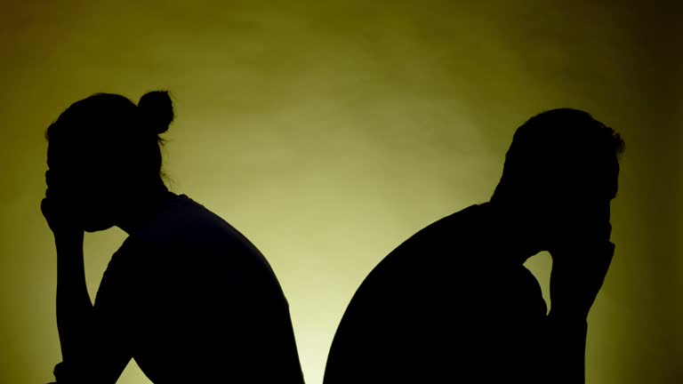 Couple. Back to back. Silhouette.