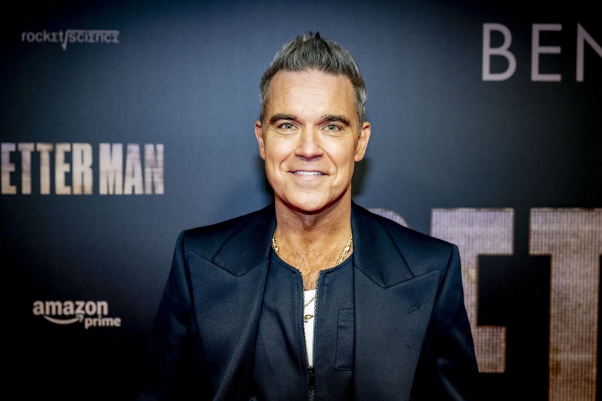 British singer and songwriter Robbie Williams poses on the red carpet during the Dutch premiere of the movie "Better Man" at the Royal Theatre Tuschinski in Amsterdam on December 10, 2024. (Photo by Robin Utrecht / ANP / AFP) / Netherlands OUT