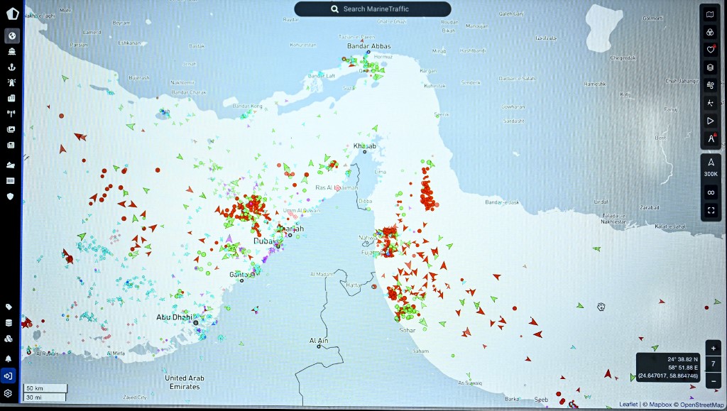 This photograph shows a page on the Marinetraffic website thats shows commercial boats traffic on the edge of the Strait of Hormuz near the Iranian coast, in Paris on March 4, 2026. (Photo by JULIEN DE ROSA / AFP)